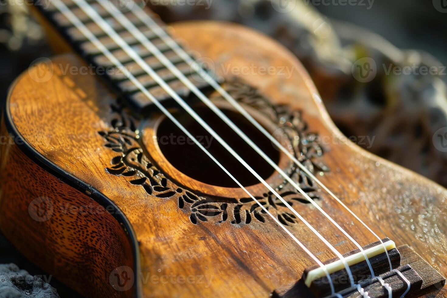 Traditional hawaiian ukulele laying on lava rocks in the warm sunlight photo
