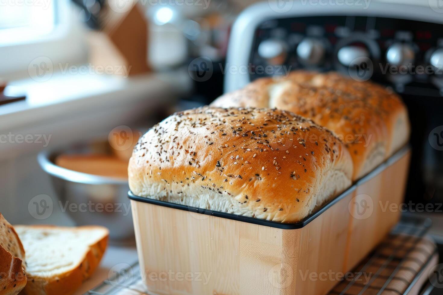 Two loaves of freshly baked bread cooling in a kitchen photo