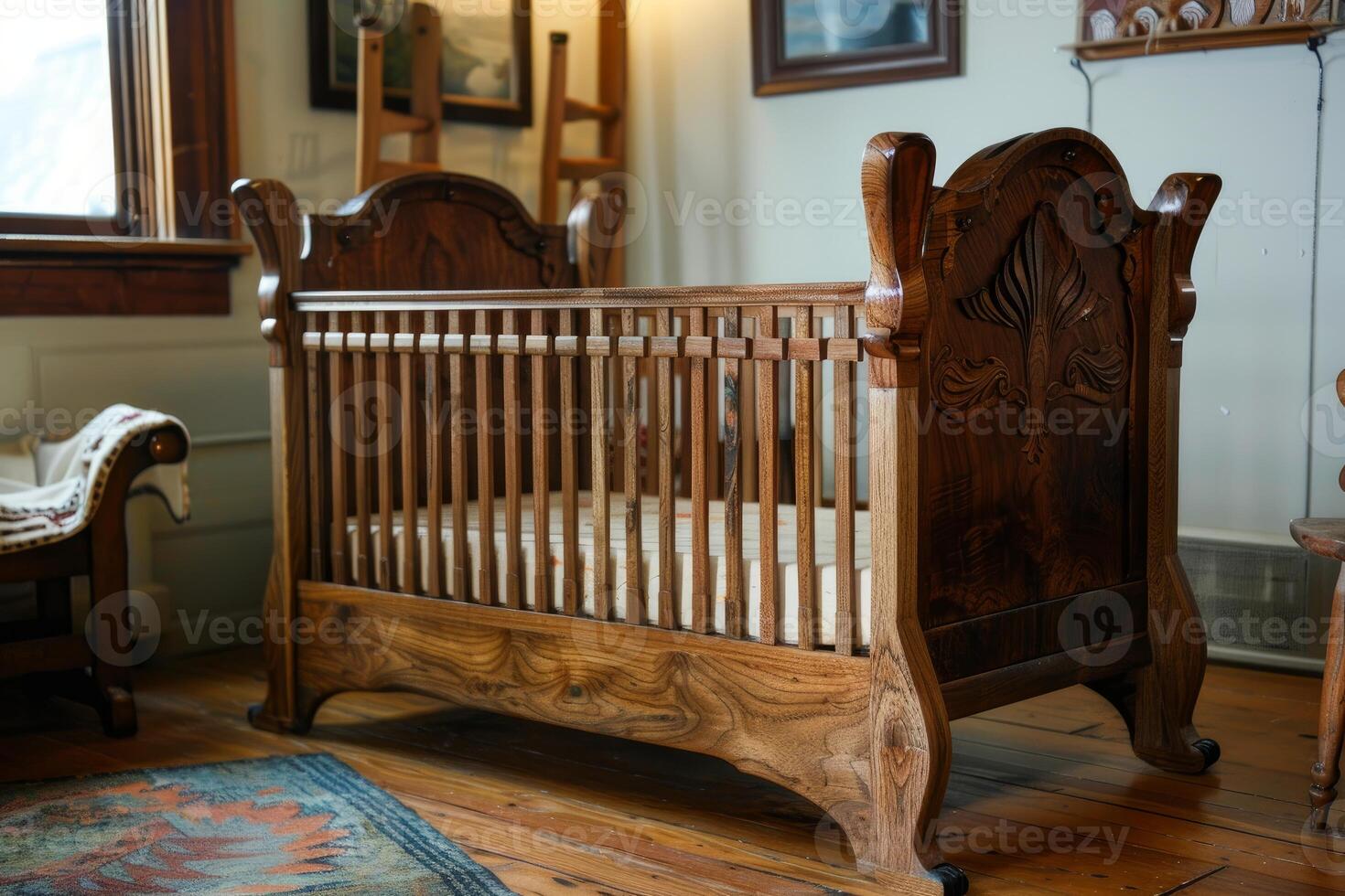 Antique wooden baby crib standing on hardwood floor in rustic room photo