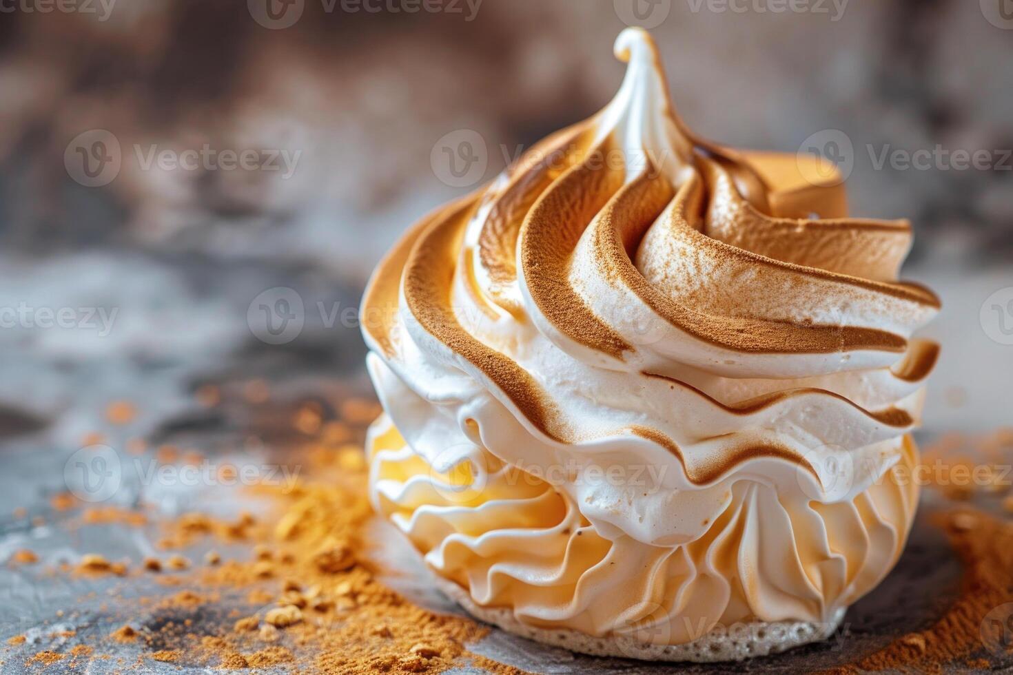 Delicious meringue dessert sitting on crumbs on gray textured surface photo