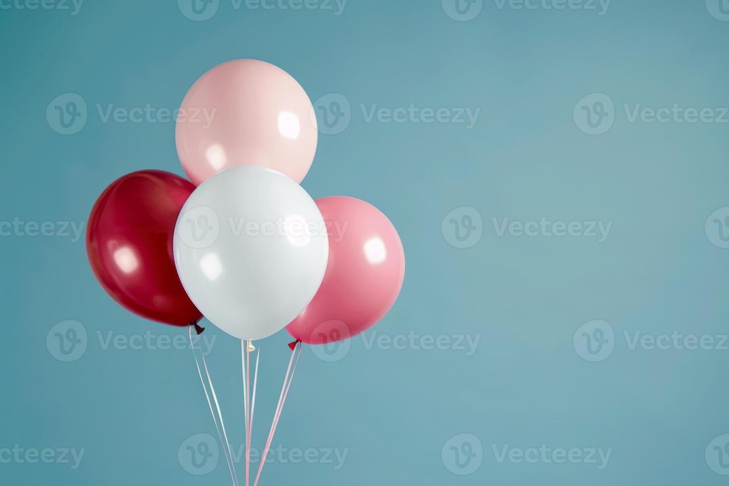 Bunch of colorful balloons floating on minimalist blue background photo