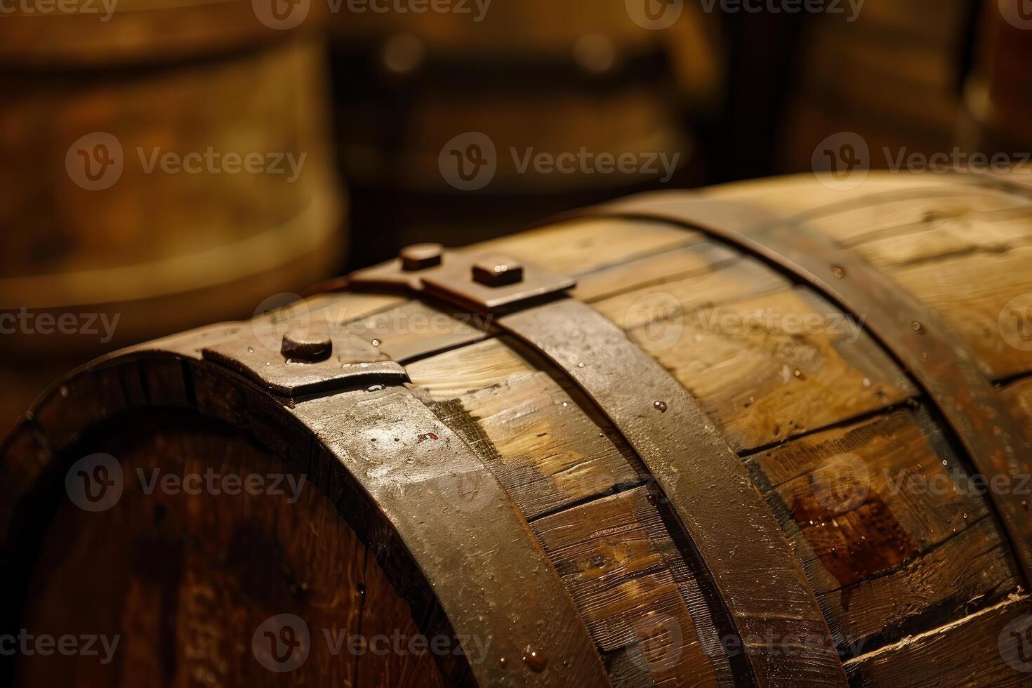 Old wooden barrel with metal rings in a cellar photo