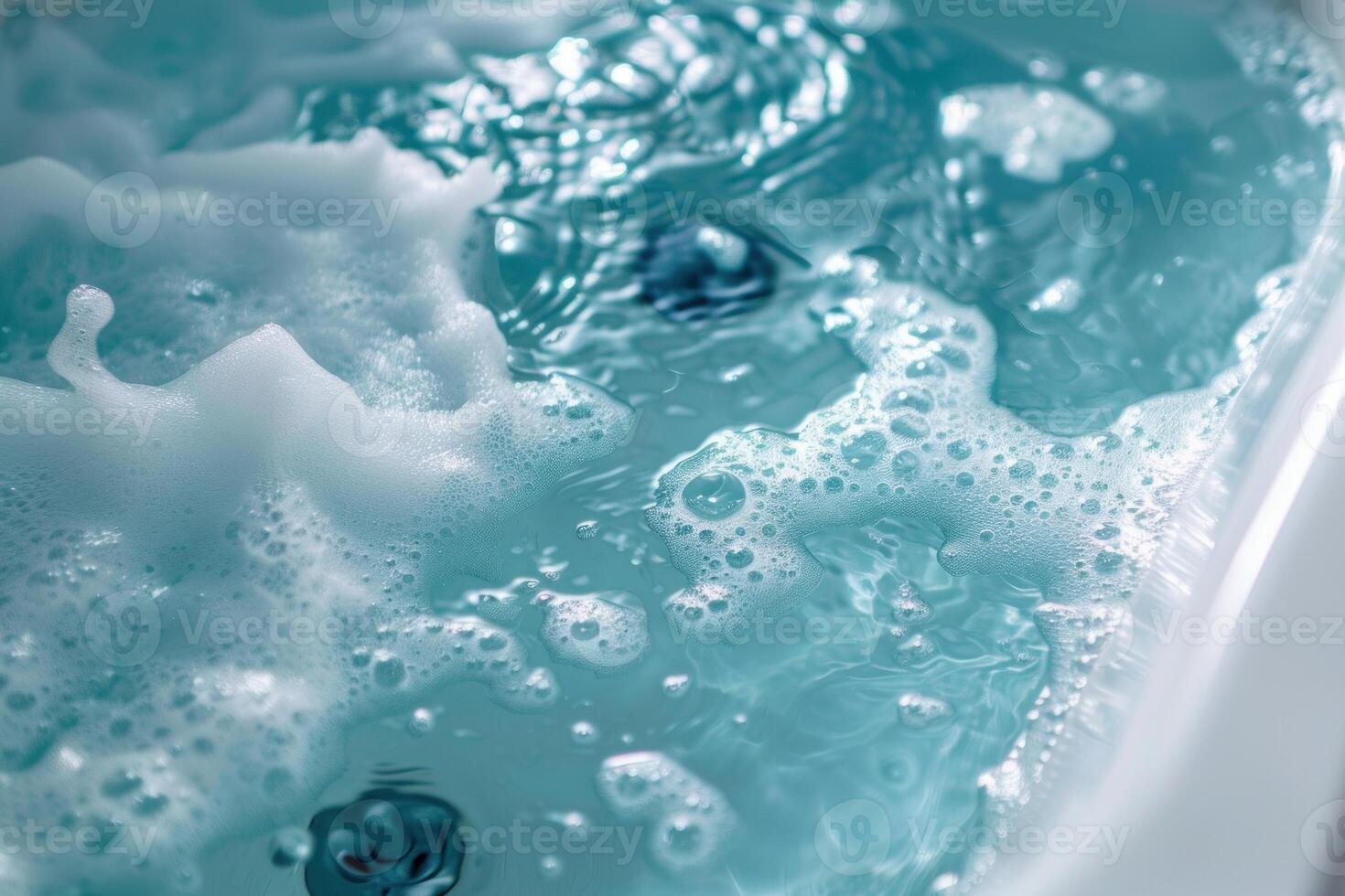 White soap foam is floating on blue water surface photo