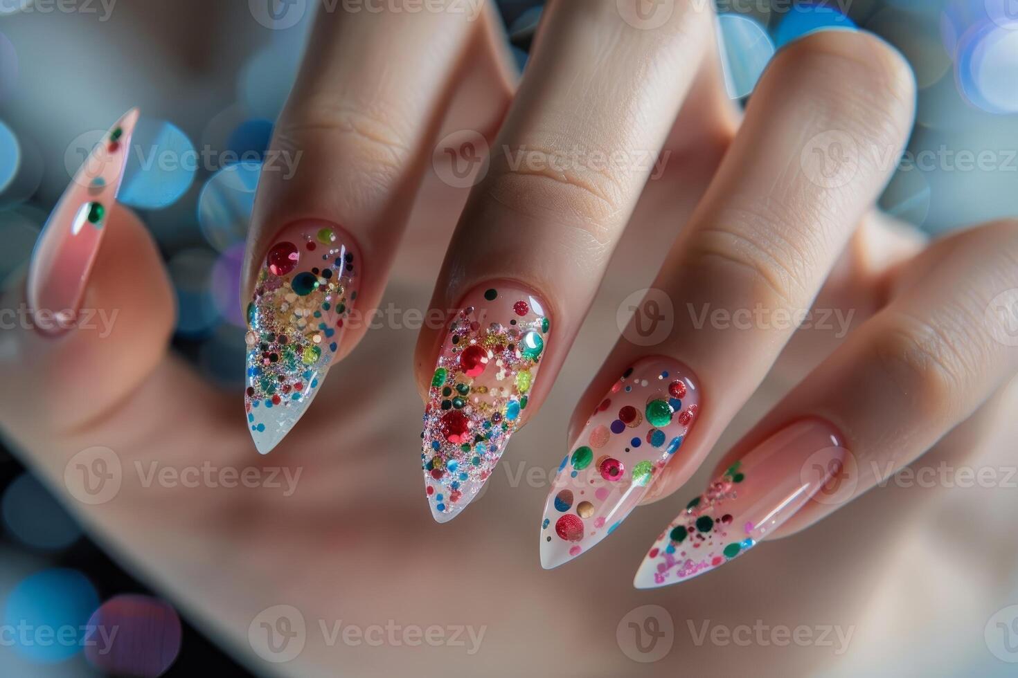 Woman hand showing colorful glitter confetti nail art design photo