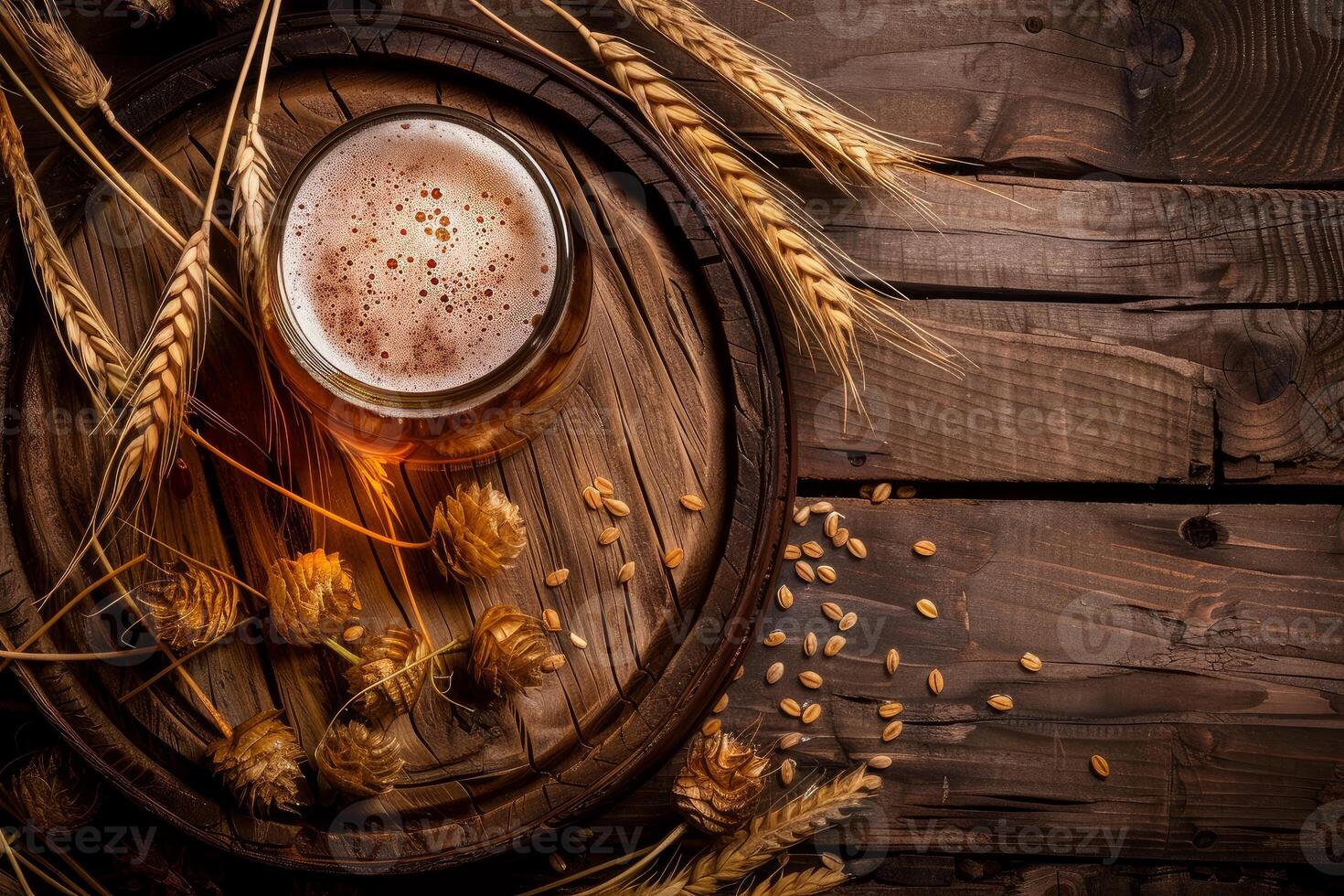 Mug of beer sitting on wooden barrel head with hops and barley photo