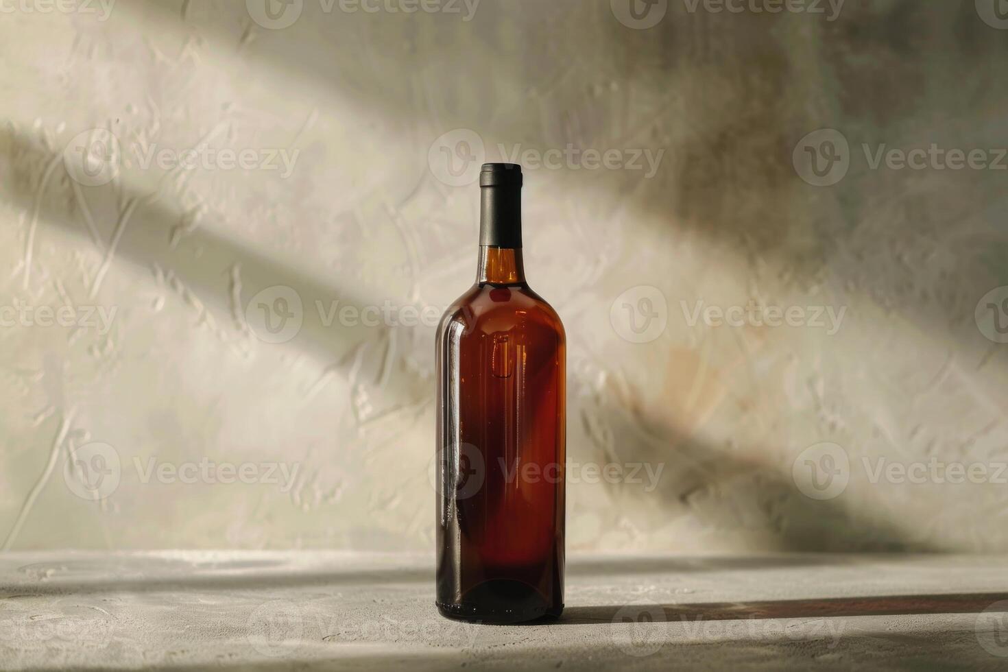 Bottle of wine casting shadow on table in sunlight photo