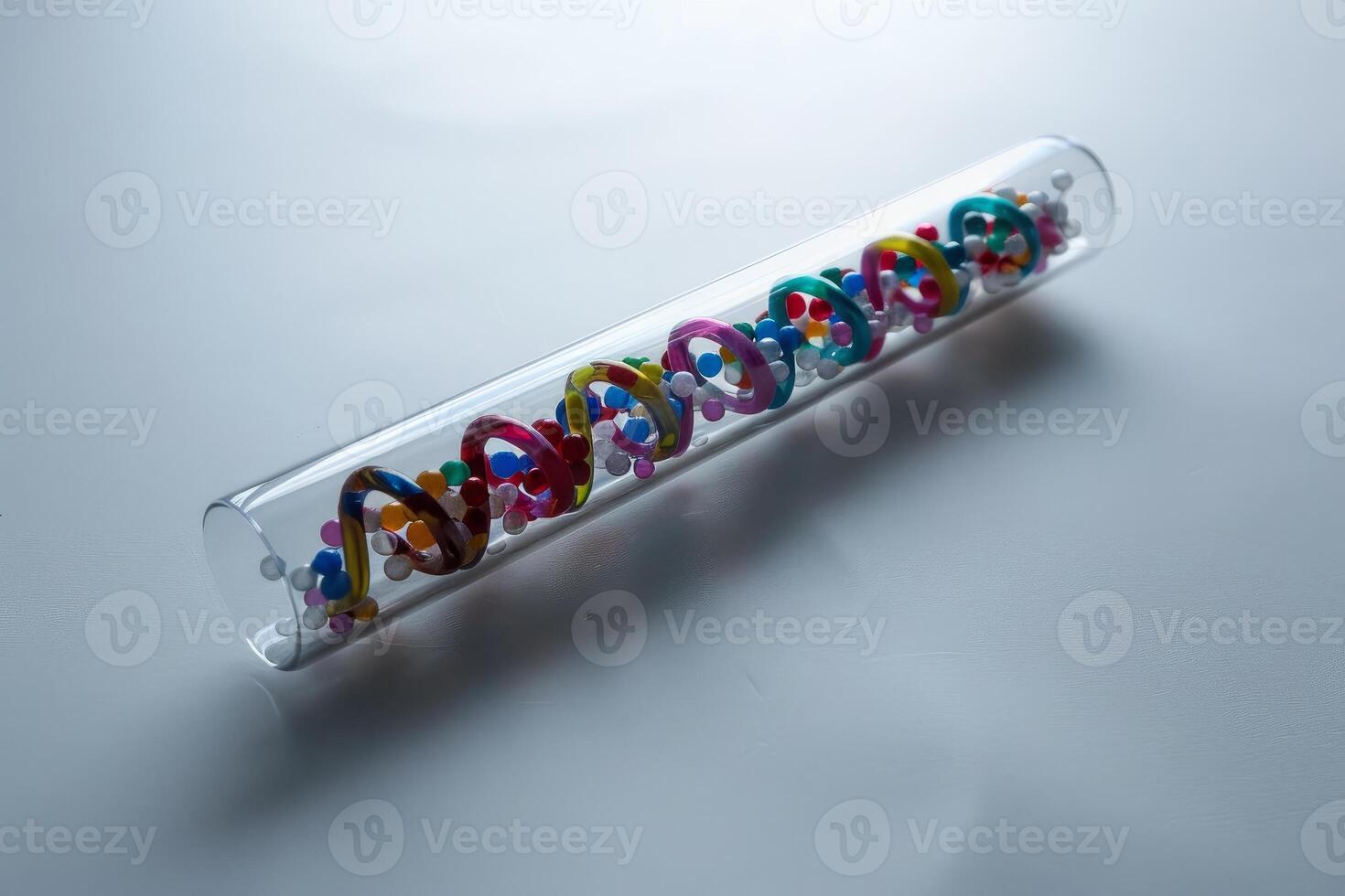 Colorful model of dna structure in test tube for science photo