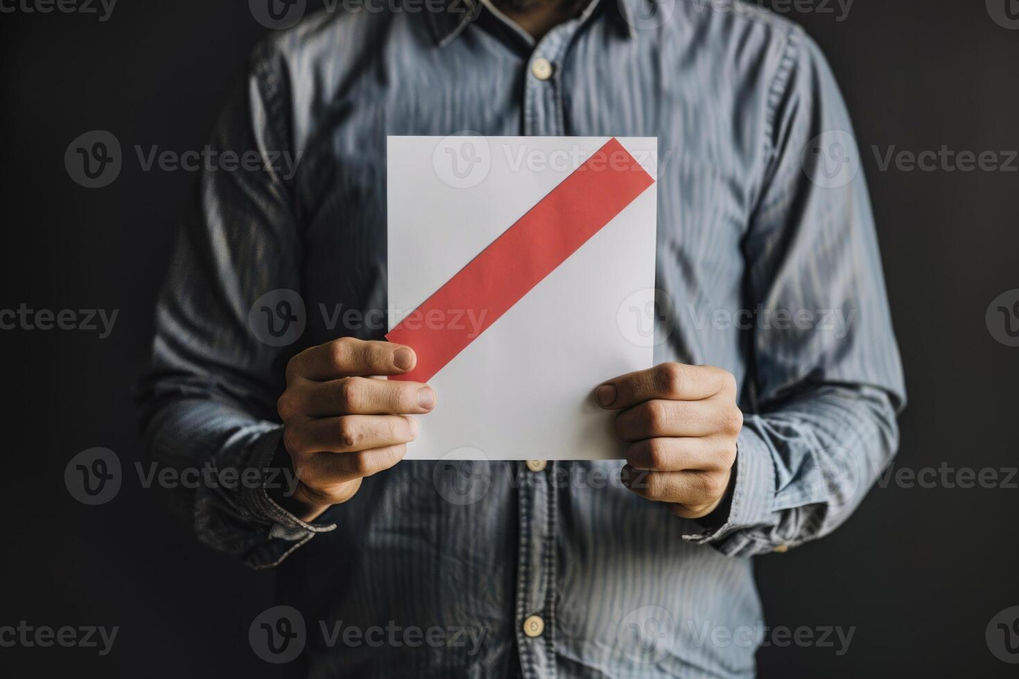 Man holding blank sign with red diagonal stripe photo