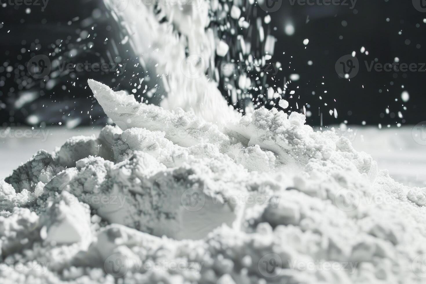 White powder falling on a pile creating a splash photo