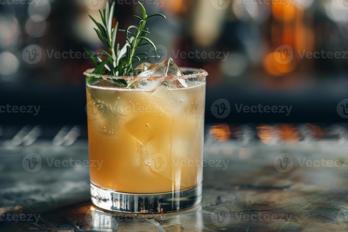 Refreshing bourbon cocktail with rosemary and ice on bar counter photo