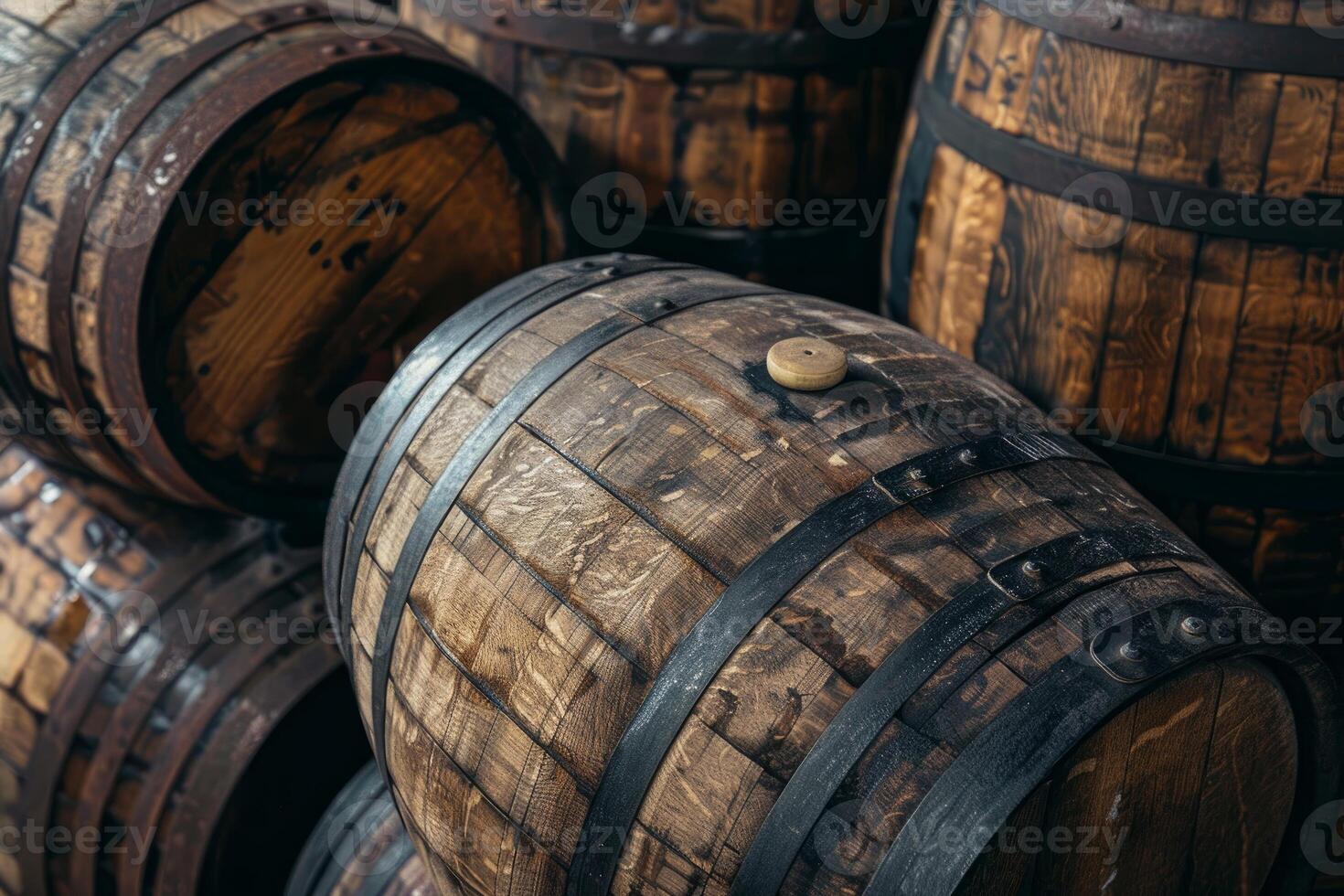 Oak barrels aging in cellar for wine or whiskey production photo