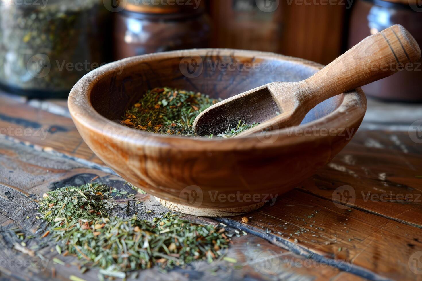 Dried herbs and wooden scoop resting in bowl on rustic table photo