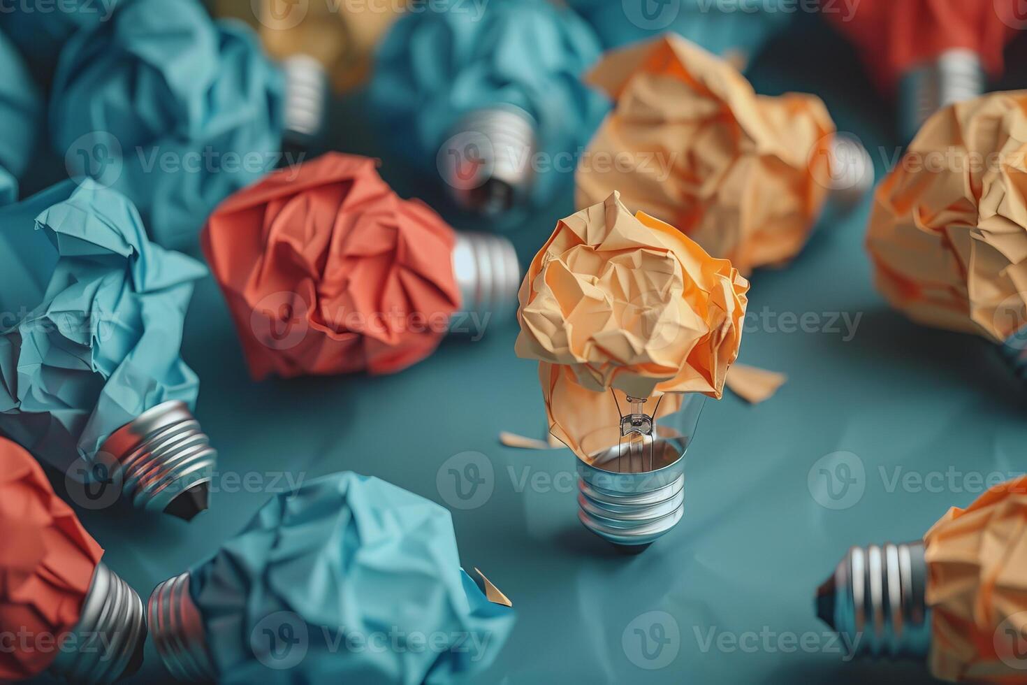 Glowing crumpled paper lightbulb showing different thinking photo