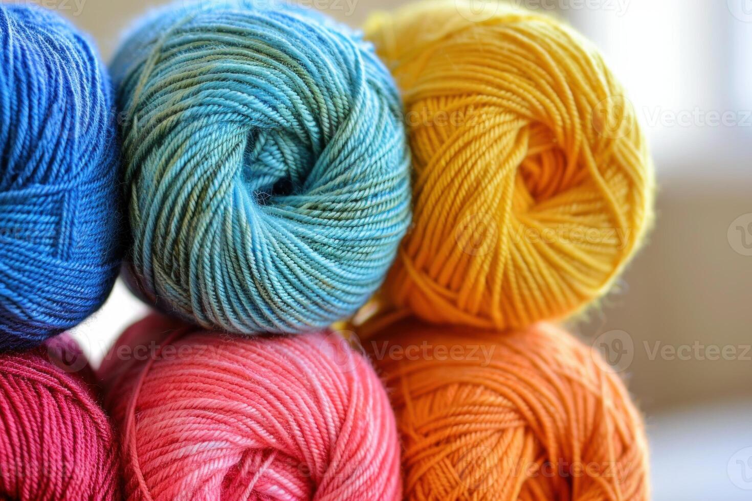 Colorful yarn balls stacked creating a warm and cozy atmosphere photo