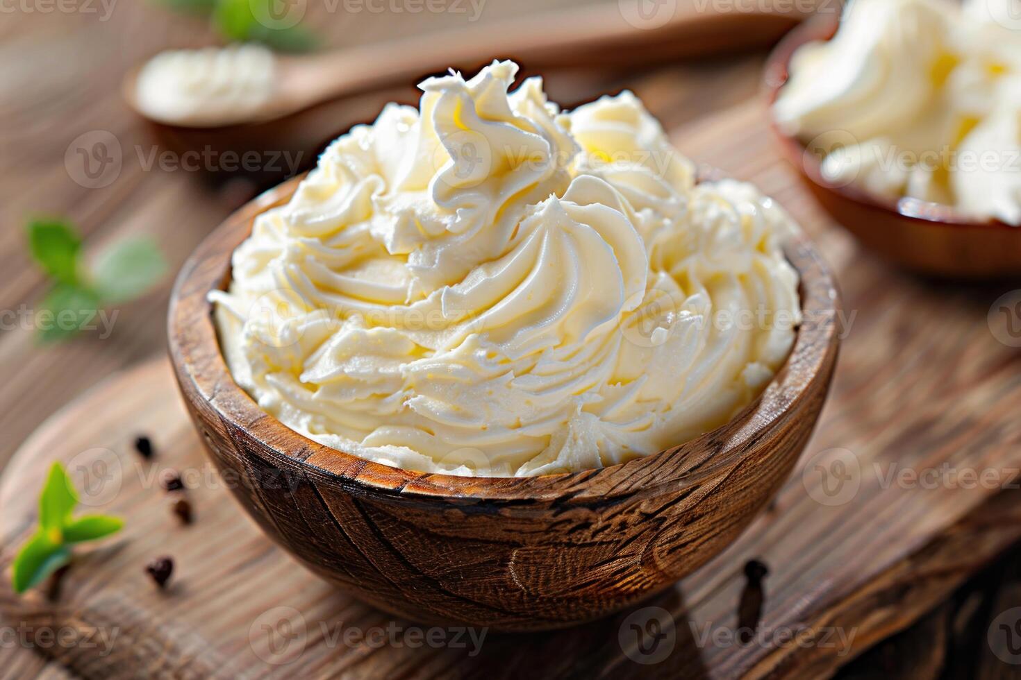Mascarpone cheese cream in wooden bowl on rustic table photo