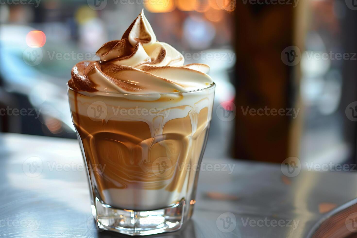 Creamy coffee beverage topped with whipped cream and cocoa powder photo