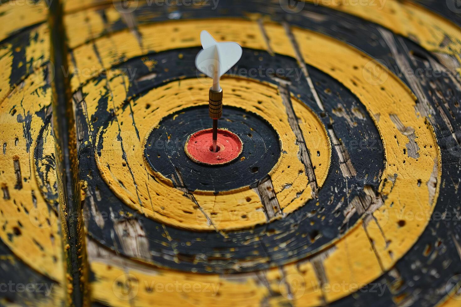 Dart hitting the center of an old target, achieving objectives with precision and accuracy photo
