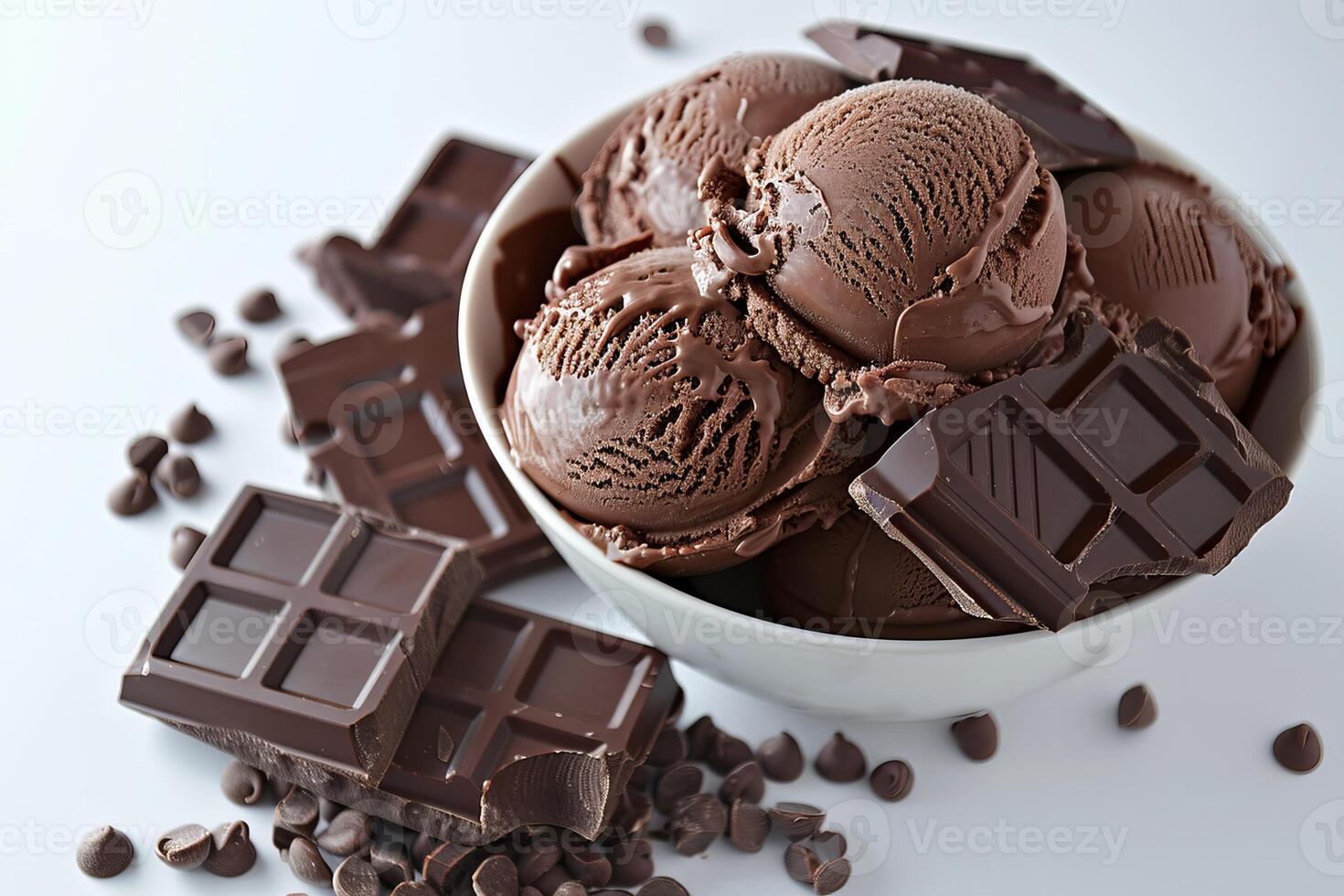 Chocolate ice cream scoops with chocolate chunks and chocolate bars on white background photo