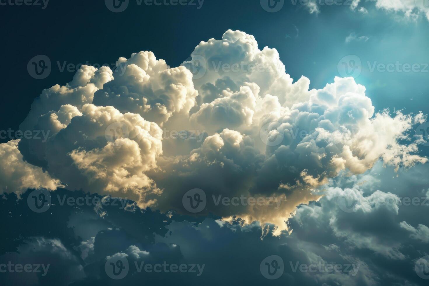 Sunlight filtering through majestic cumulus clouds in a vast blue sky photo