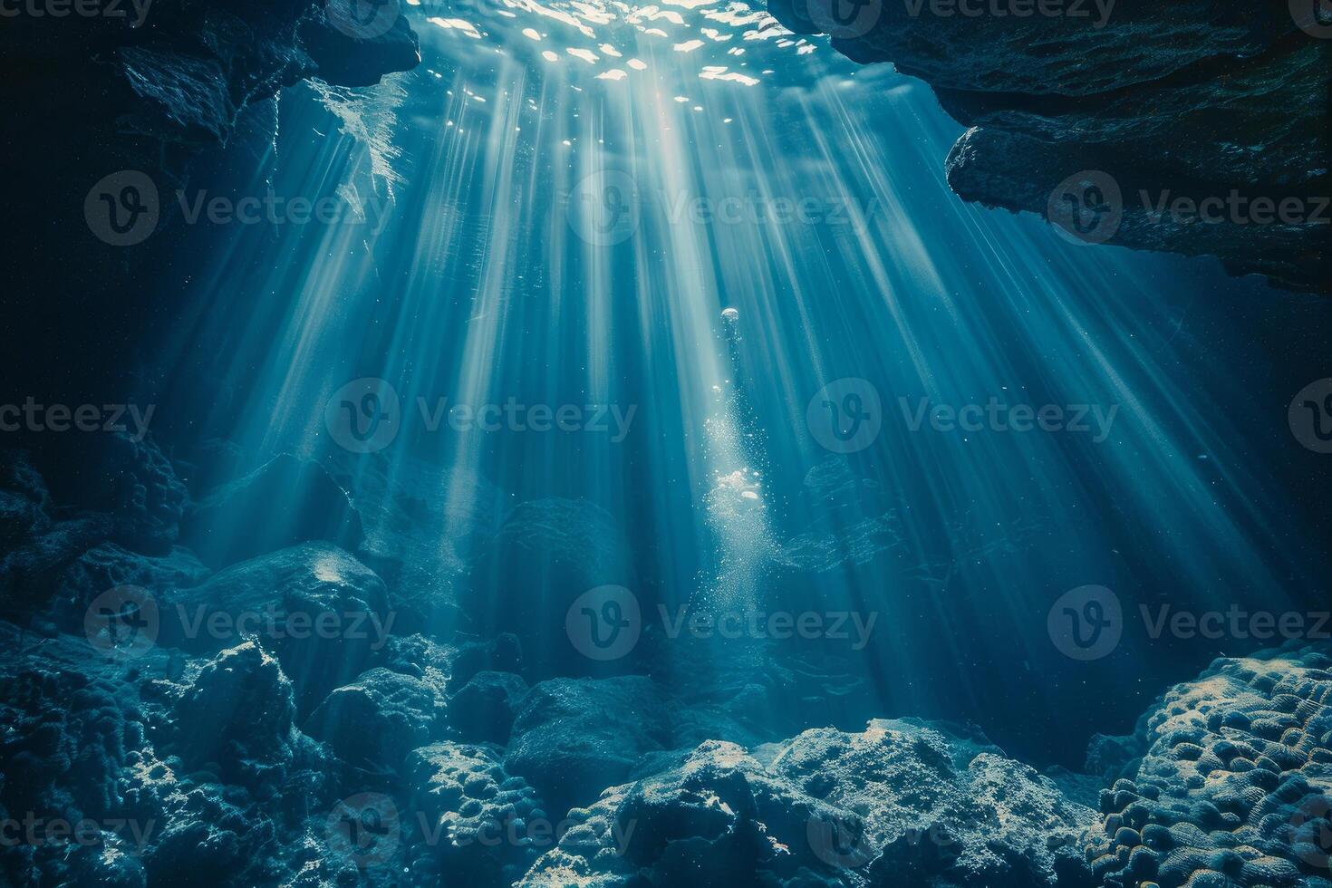 Underwater cave illuminated by sunbeams creating a magical atmosphere photo