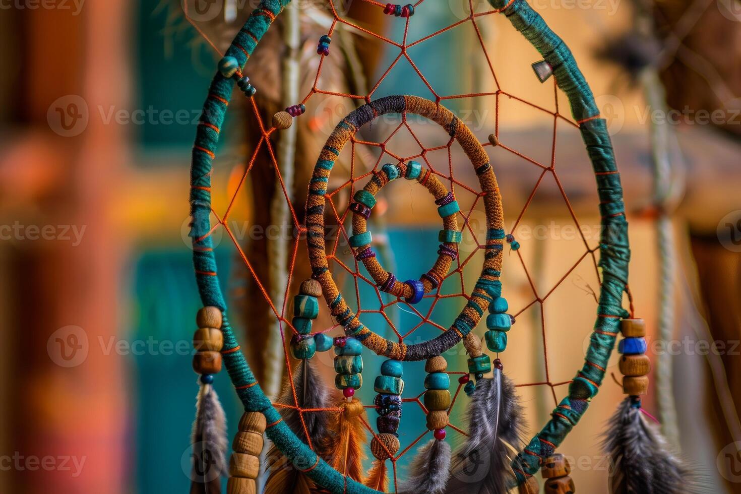 Native american dreamcatcher hanging with colorful beads and feathers photo
