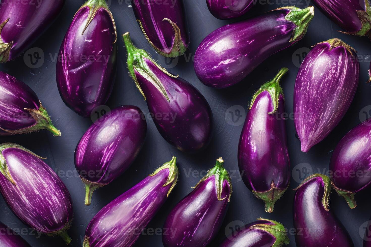Fresh graffiti eggplants arranged on dark background, overhead view photo