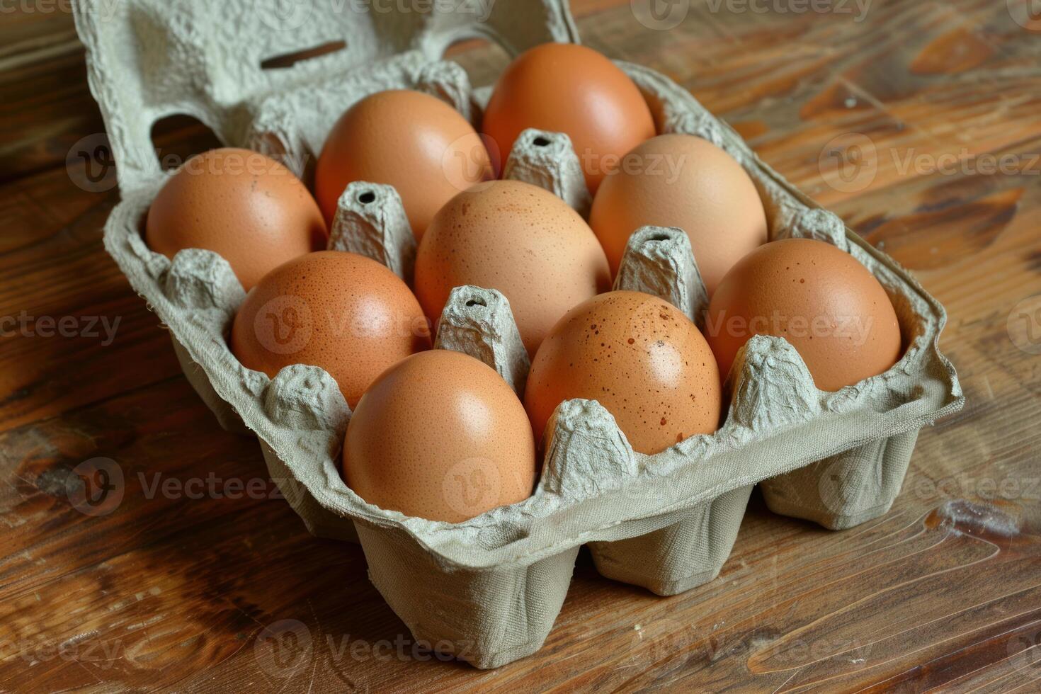 Ten brown eggs resting in open carton on rustic wooden table photo