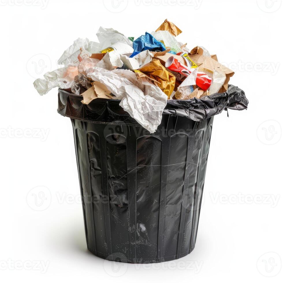 Overflowing black trash can full of garbage on white background photo
