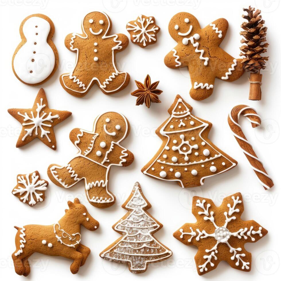 Christmas gingerbread cookies forming various festive shapes on white background photo
