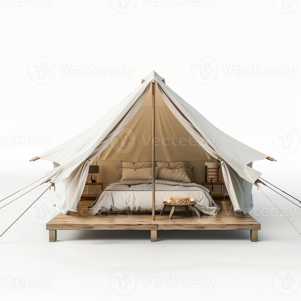 Large canvas tent with double bed on wooden platform standing on white background photo