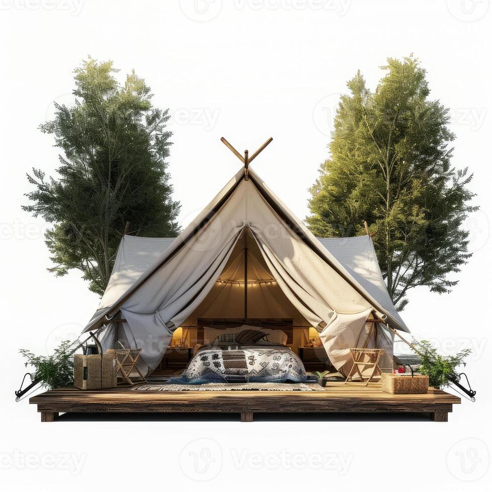Luxurious glamping tent with bed and furniture between trees on a wooden platform photo