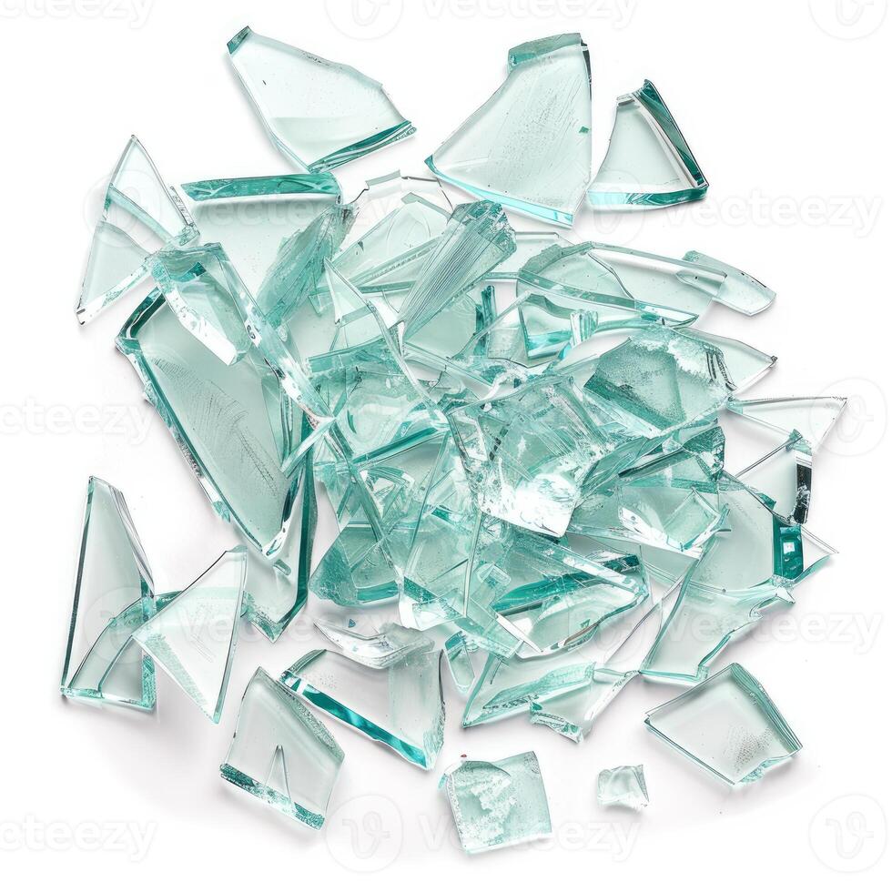 Pile of sharp transparent shards of broken glass forming abstract pattern photo