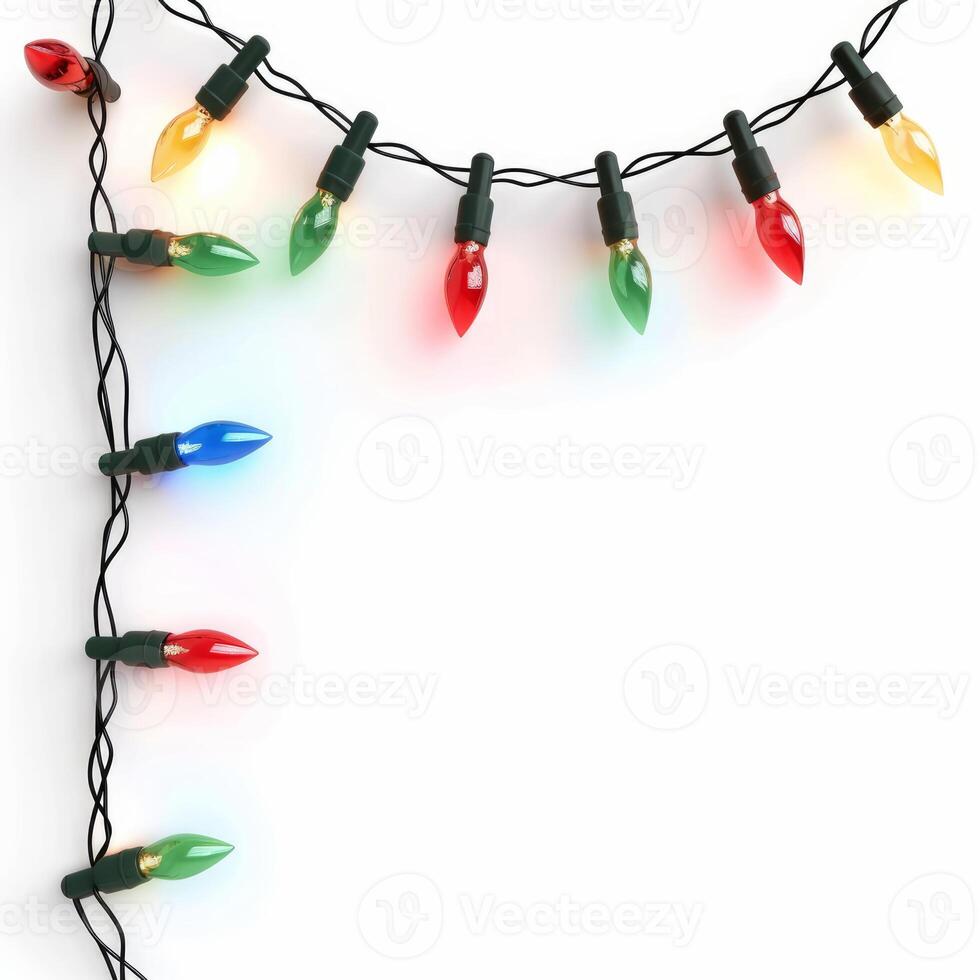 Colorful christmas lights string forming a border on white background photo