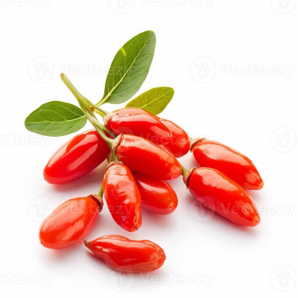 Ripe goji berries with leaves lying on a white surface photo