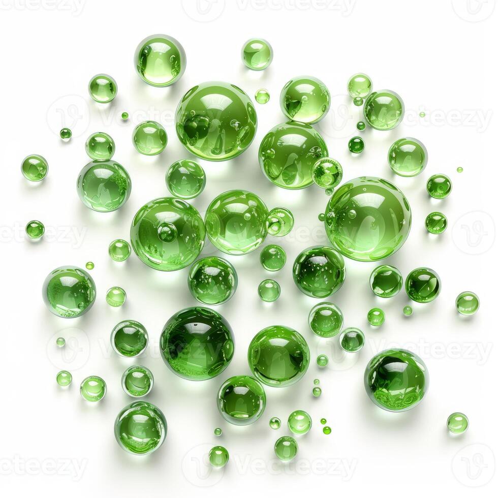 Many green spheres of different sizes are lying on a white surface photo