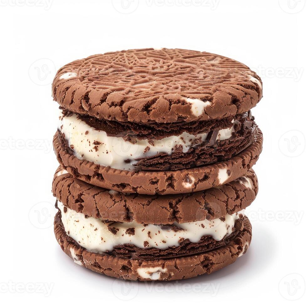 Stack of chocolate sandwich cookies with ice cream filling on white background photo