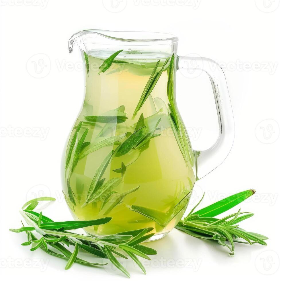 Refreshing tarragon drink infused with fresh herbs in glass pitcher photo