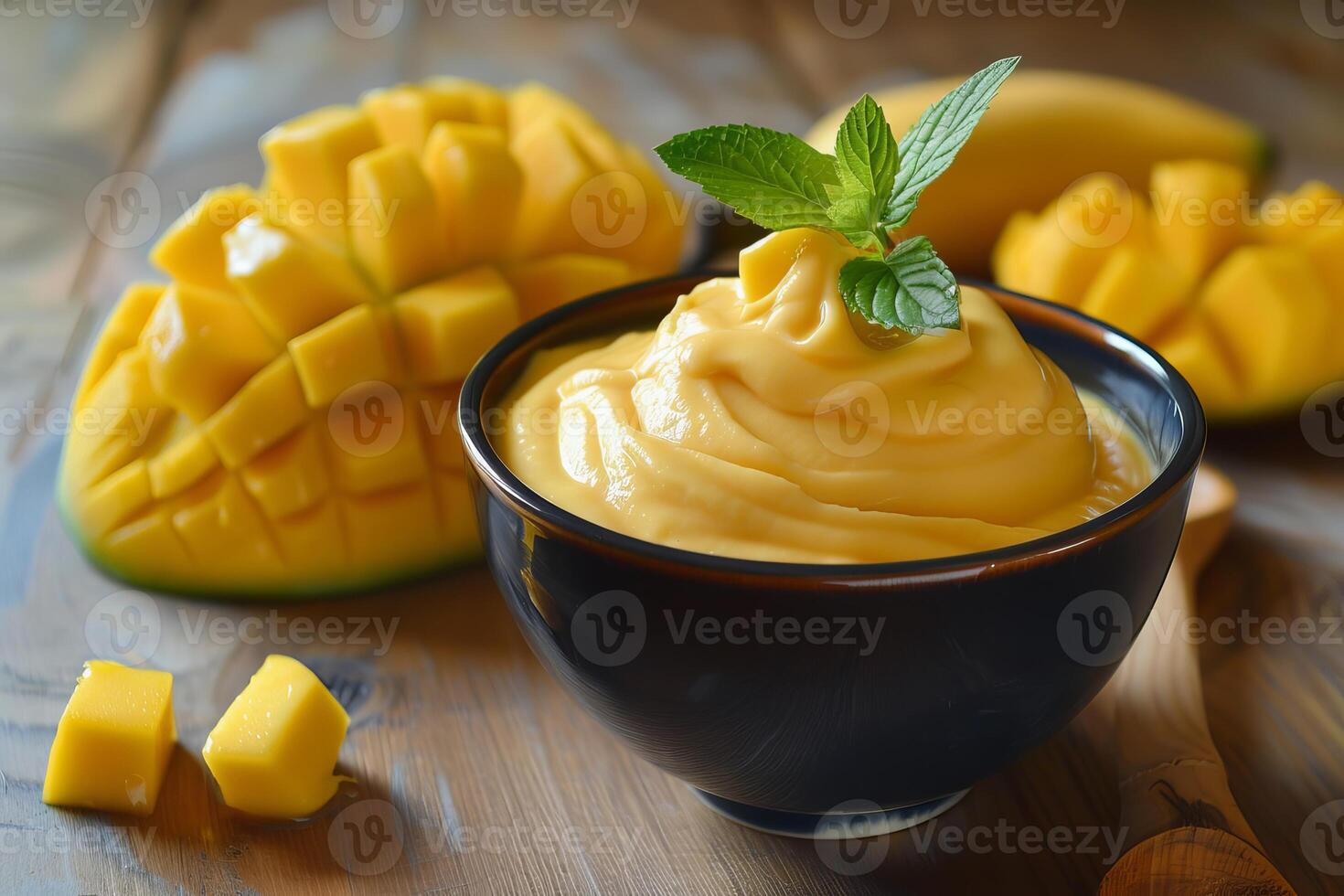 Delicious mango mousse decorated with fresh mint leaves photo