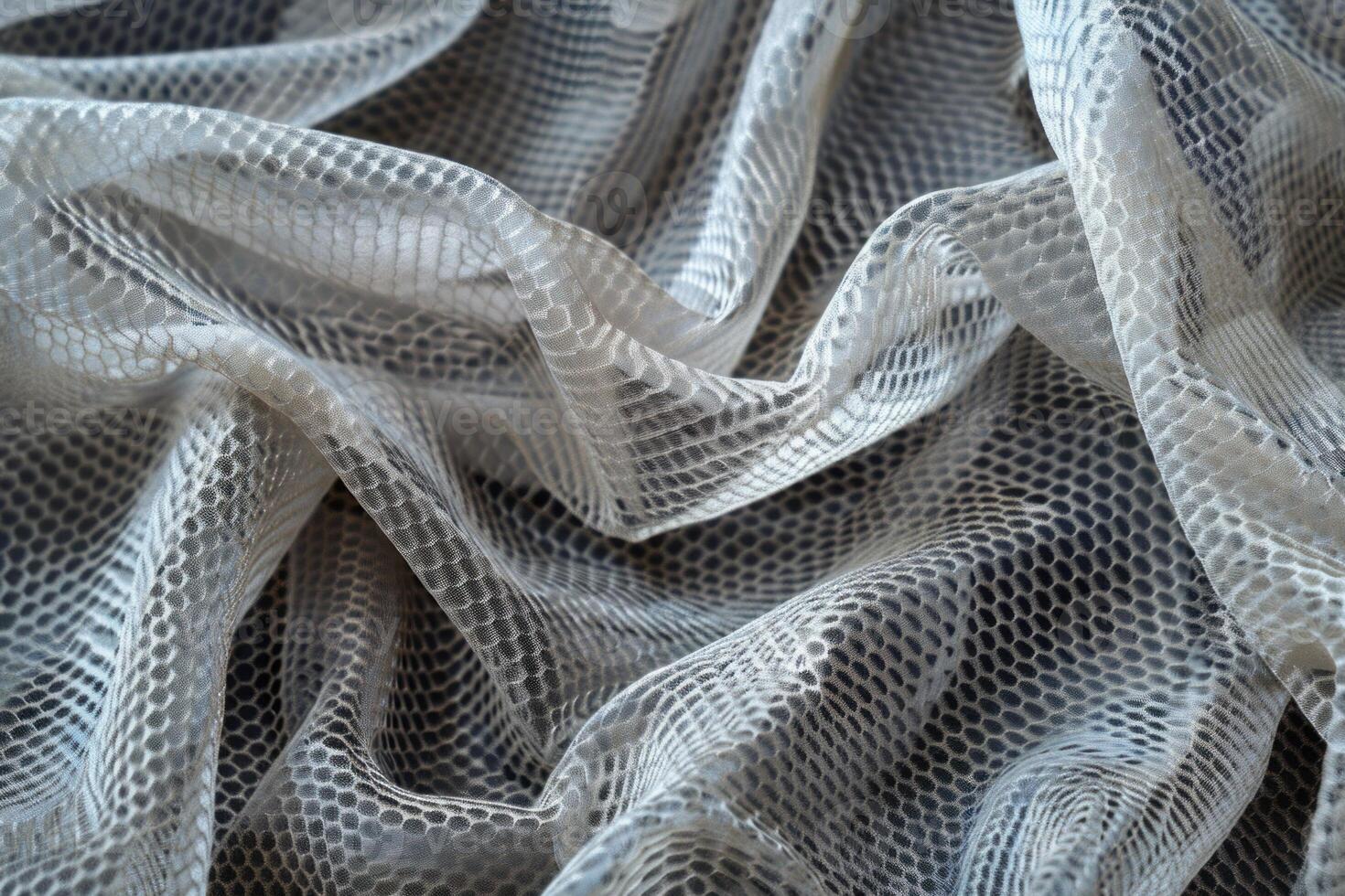 White transparent fabric with cellular pattern forming elegant waves photo