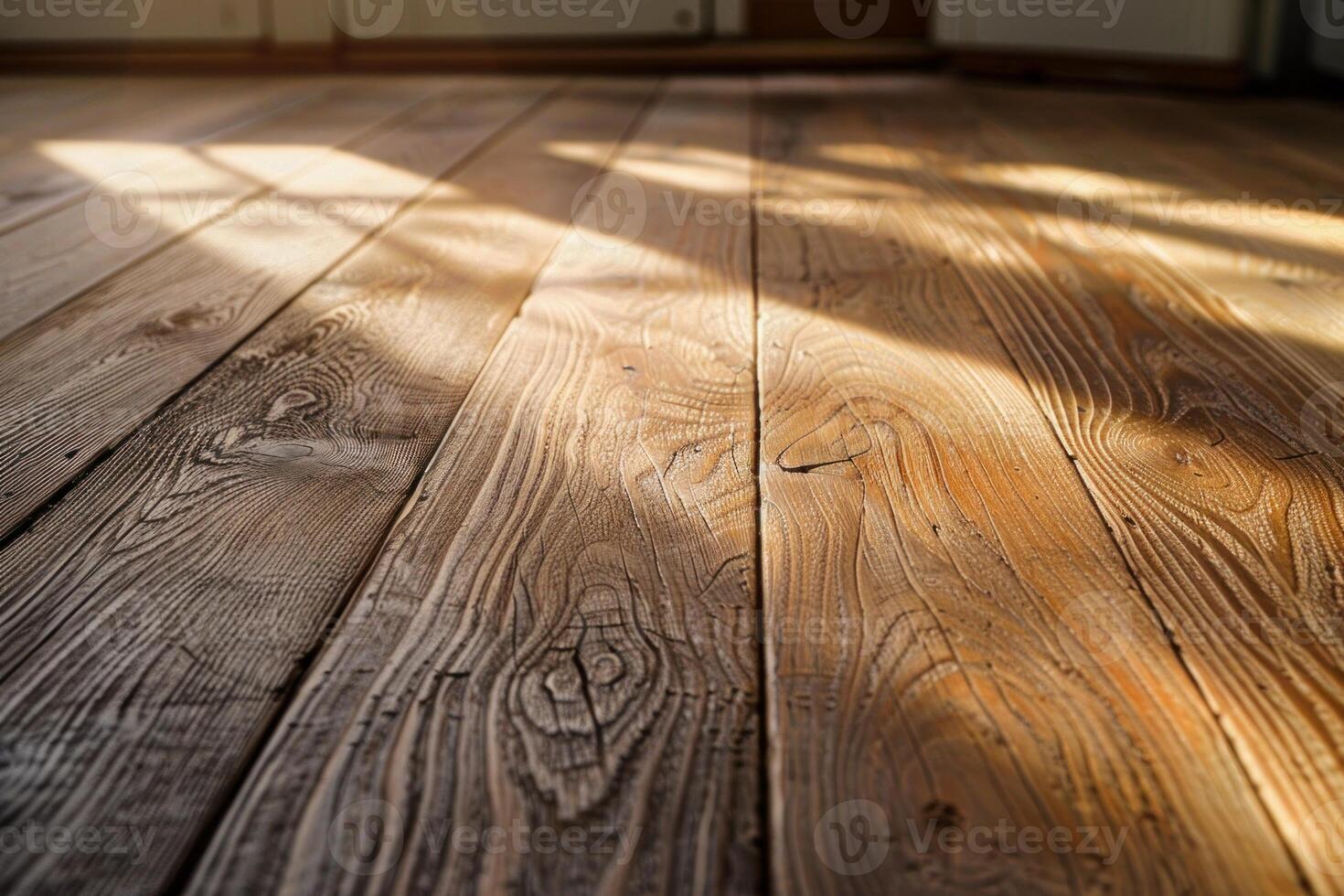 Sunlight illuminating rustic wooden floor in empty room photo
