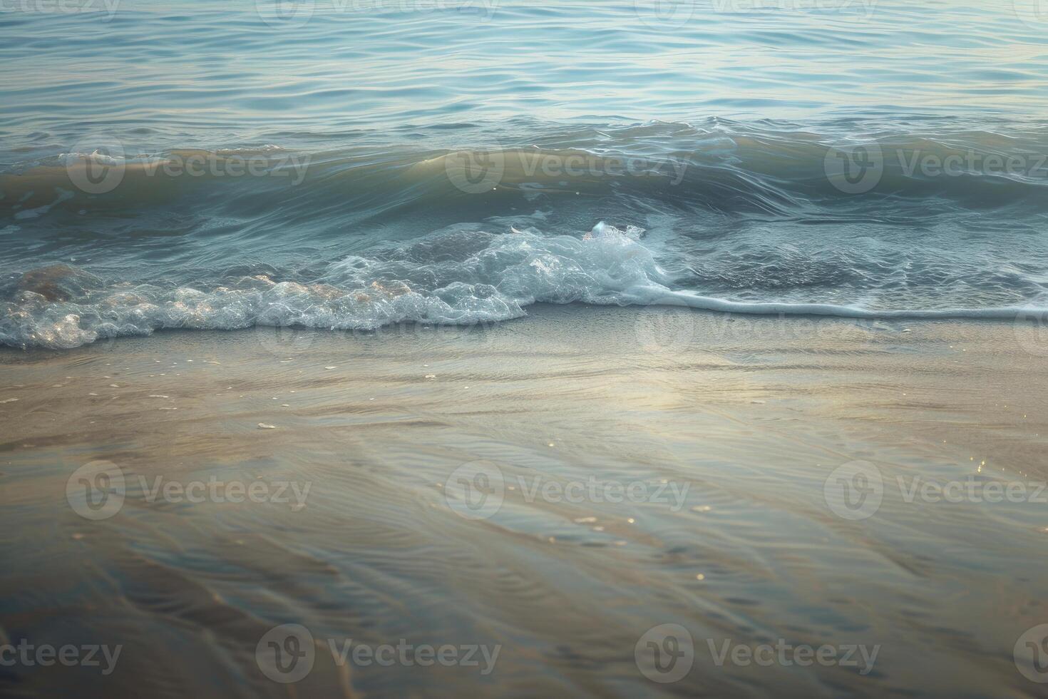 Gentle waves washing sandy beach at sunset, serene coastal scene photo