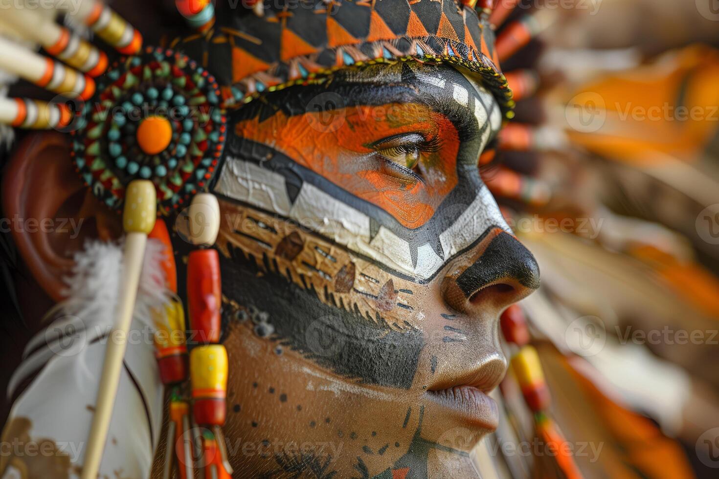 Indigenous person wearing traditional headdress and face paint photo