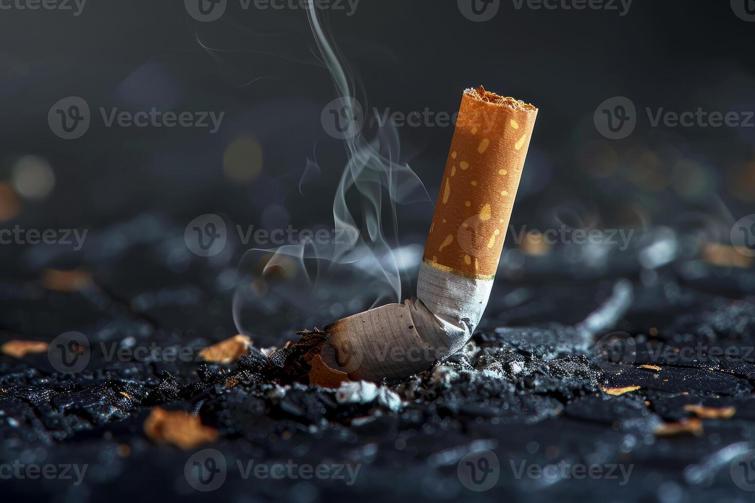 Smoldering cigarette butt resting on burned surface symbolizing smoking hazards photo