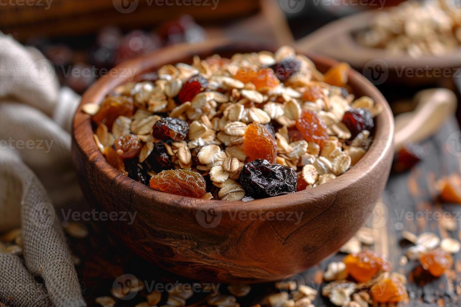 Wooden bowl overflowing with dry fruits and rolled oats, creating a healthy breakfast scene photo
