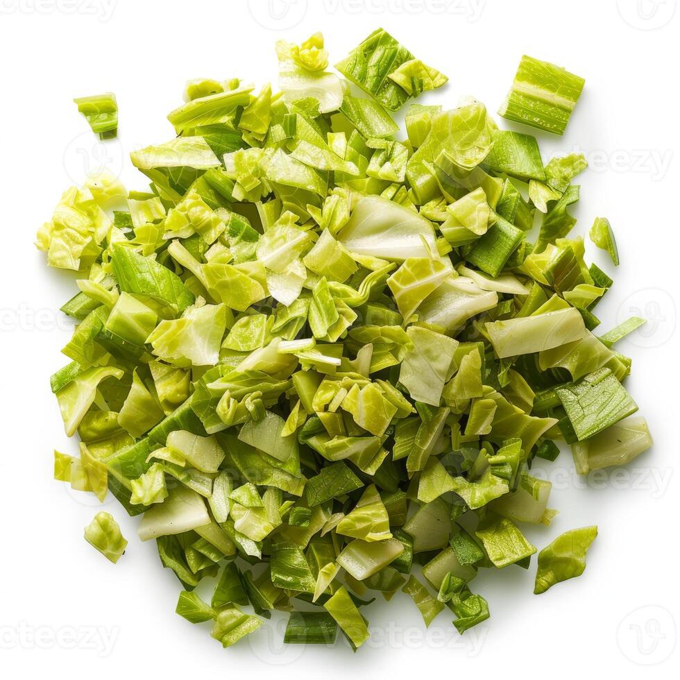 Chopped romaine lettuce forming a pile on white background photo
