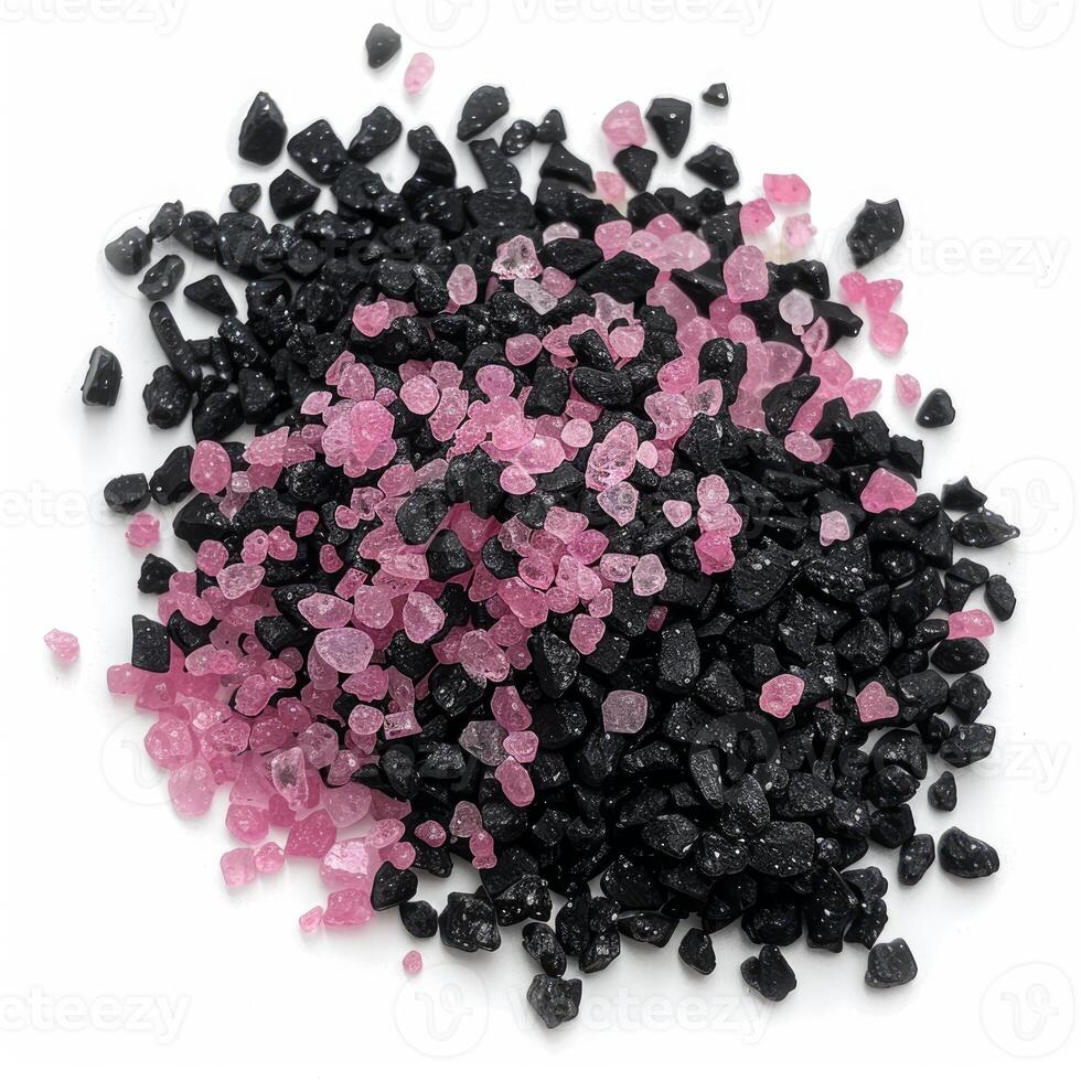 Pink and black hawaiian lava salt crystals creating a colorful contrast on white background photo