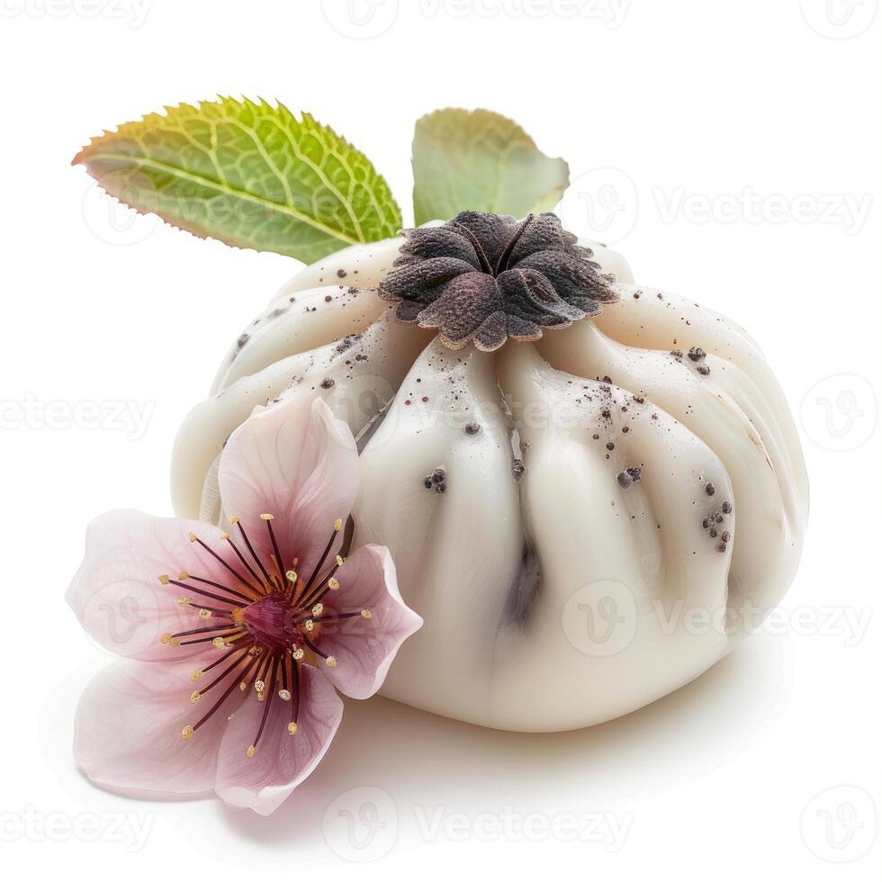 Round handmade soap bar decorated with dried flower and leaves resting near blooming pink flower photo