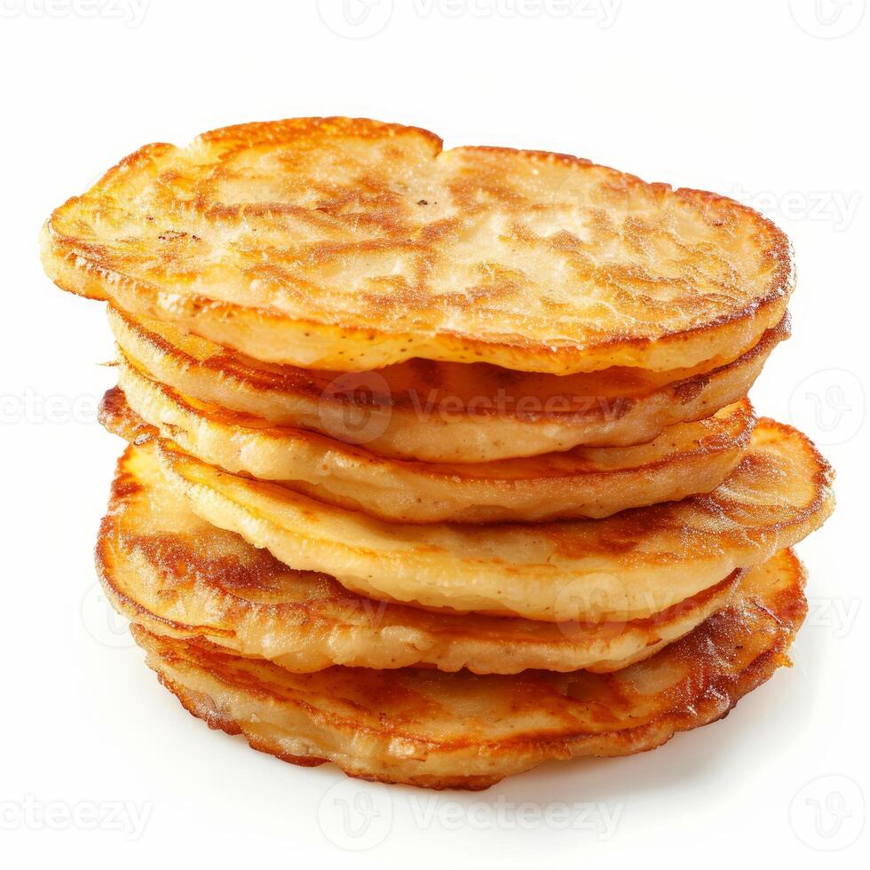 Stack of pancakes forming a delicious tower isolated on white background photo