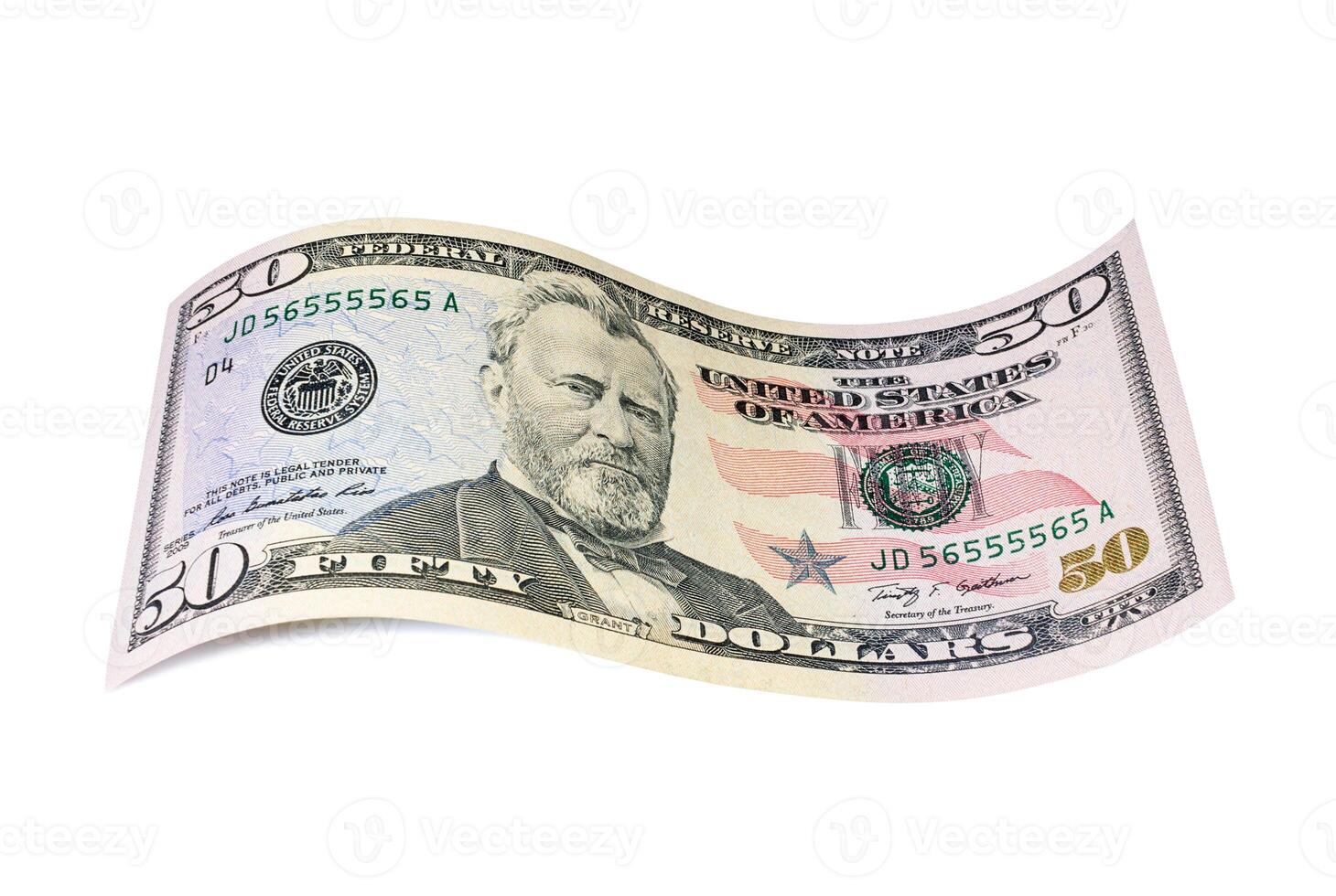 Twisted banknote of fifty US dollars. Banknotes and coins photo