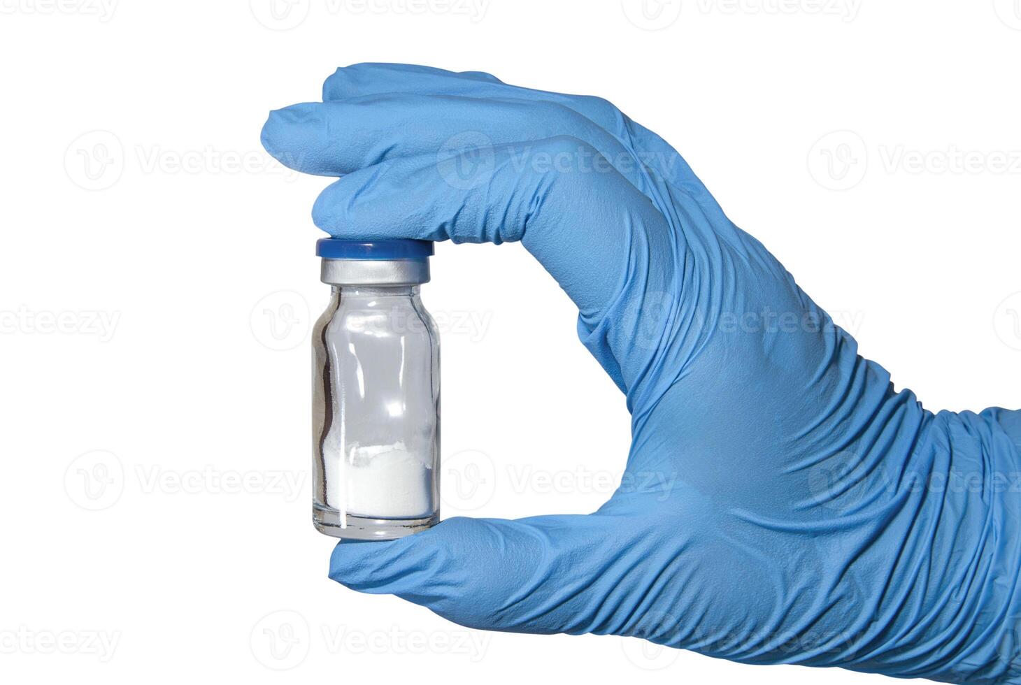 Hand in medical glove with vaccine bottle photo